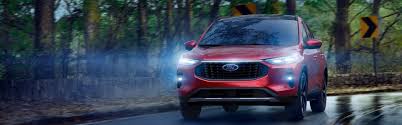 Red Ford car running Inside On the Highway. Front light on 