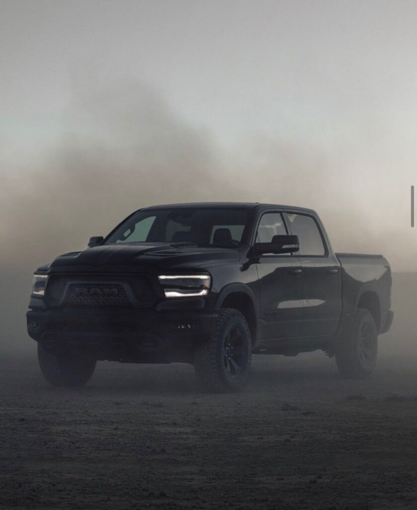 Black RAM Pickup car Under the Foggy Road