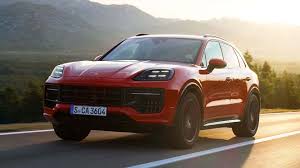 Red Porsche running down the road